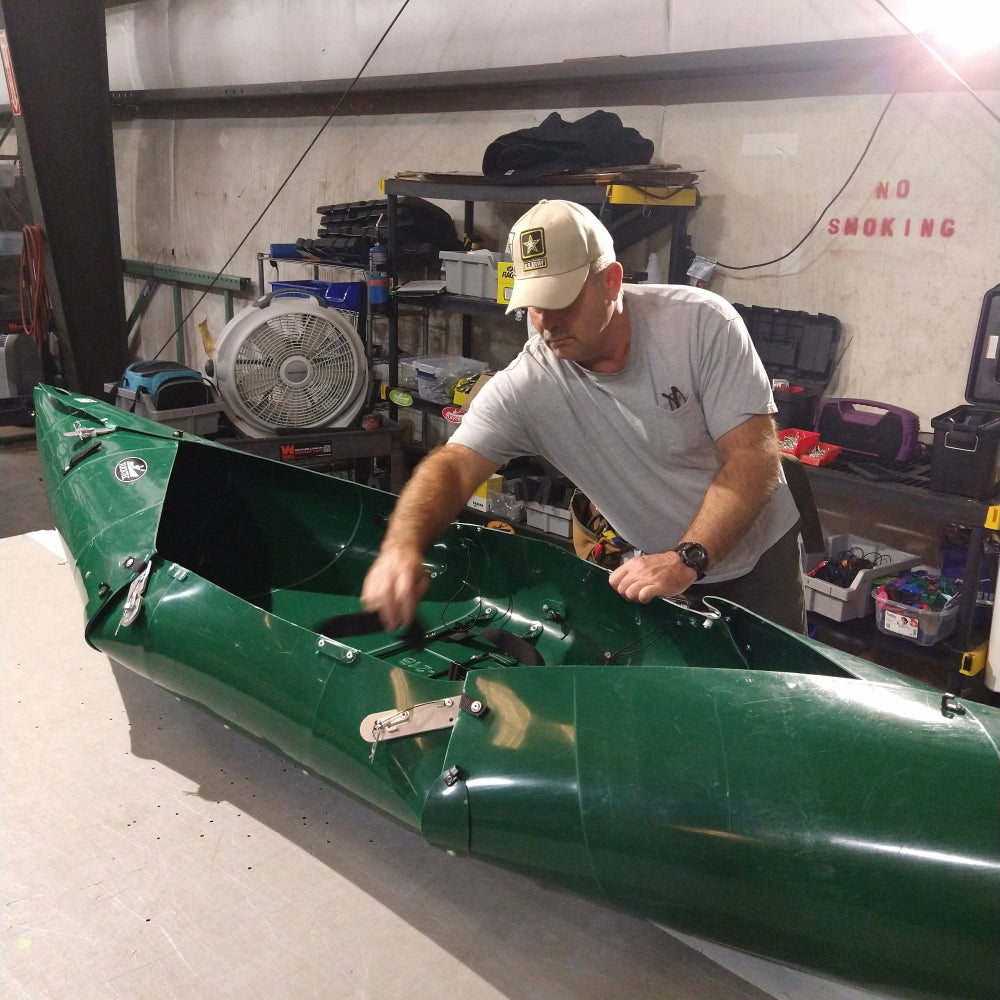 Tucktec hard-shell folding kayak assembled and on the water